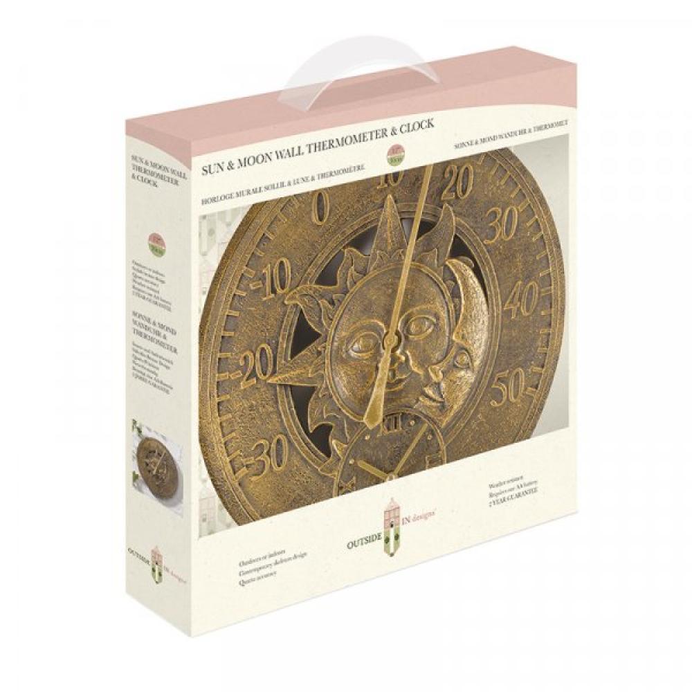 Wanduhr mit Motiv Sonne und Uhr an der Wand hängend.